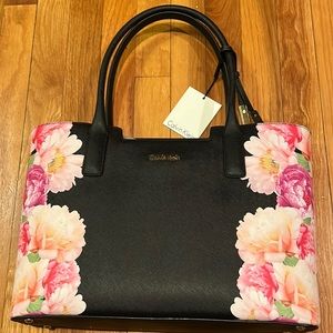 Calvin Klein bag, brand new never used with tags. Black with flower design